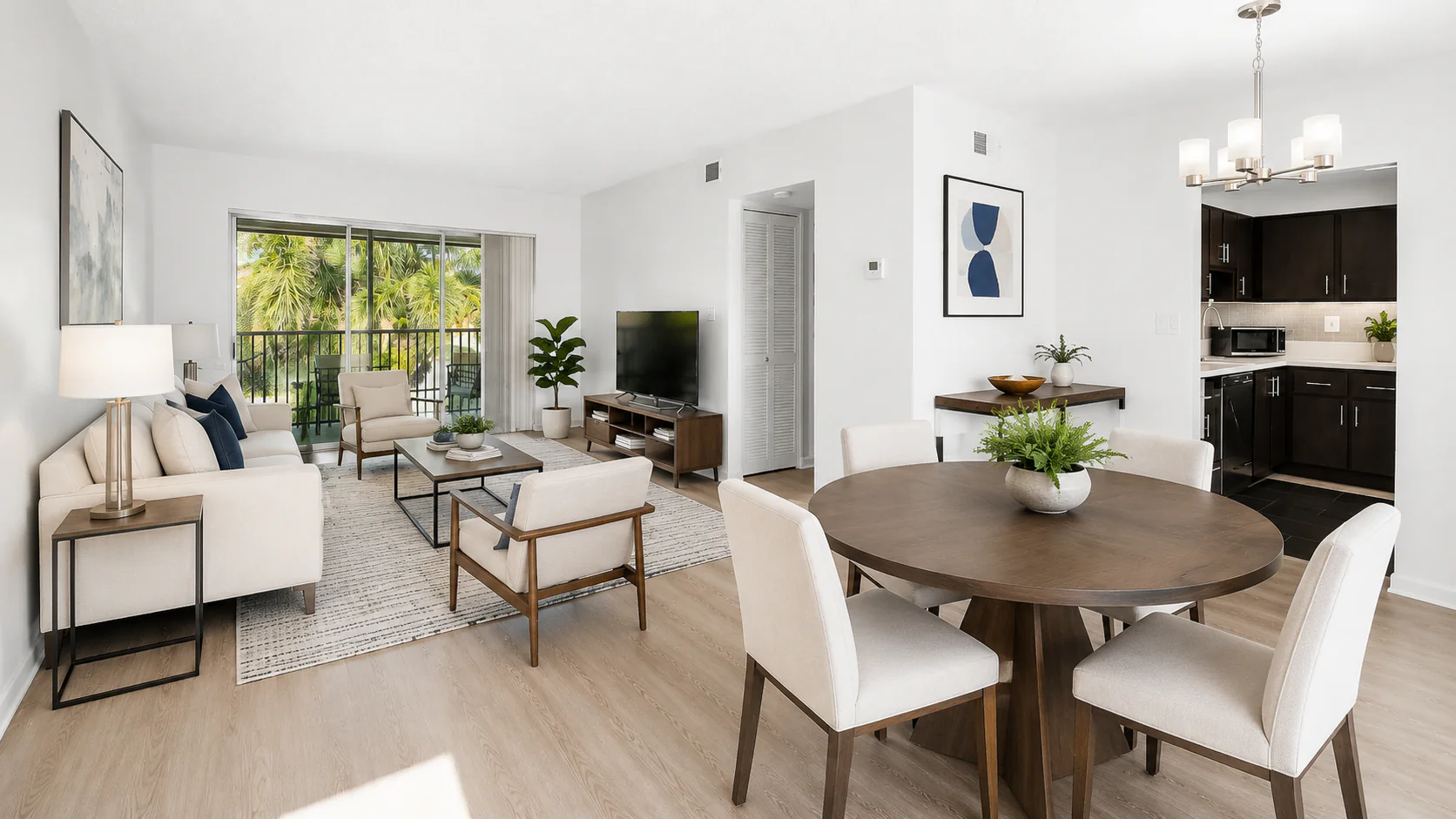 Open-plan Boca STR living, dining, and kitchen spaces