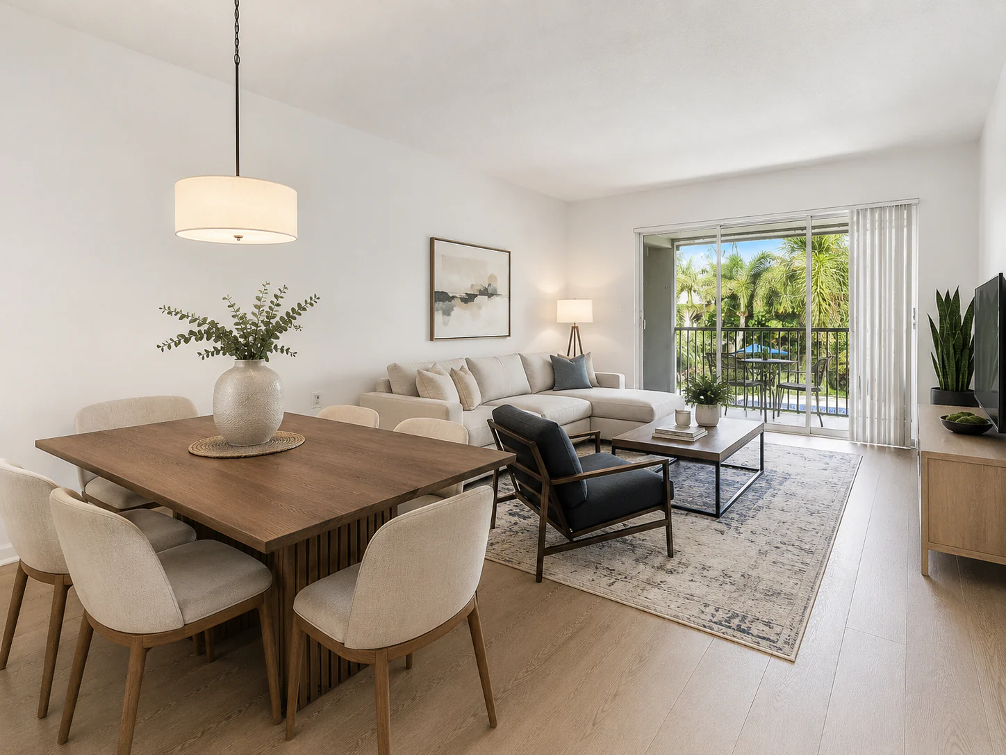 Open-plan Boca STR dining and living room with balcony views