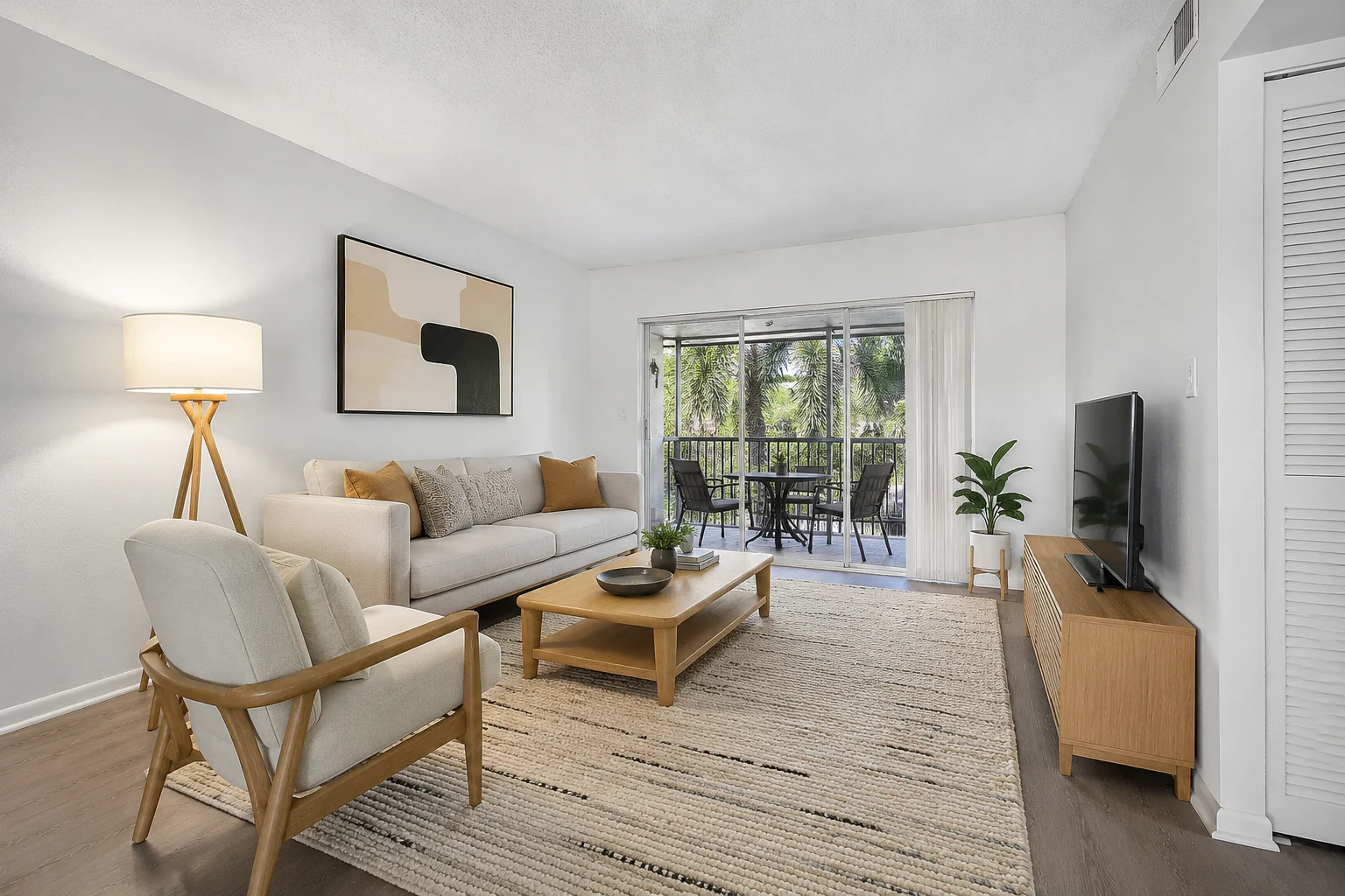 Furnished Boca STR living room facing the screened balcony
